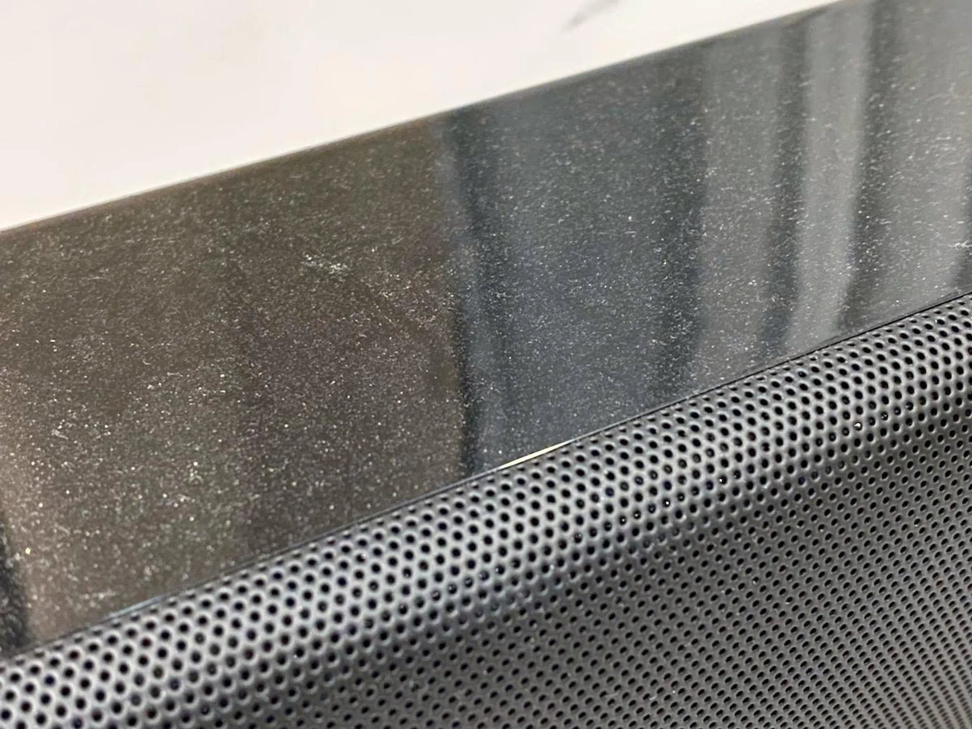 The glossy plastic finish needs to be cleaned regularly because it doesn't hide dust very well.