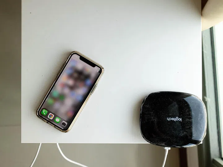 Charging my iPhone on an IKEA Rällen fixed to an IKEA side desk.