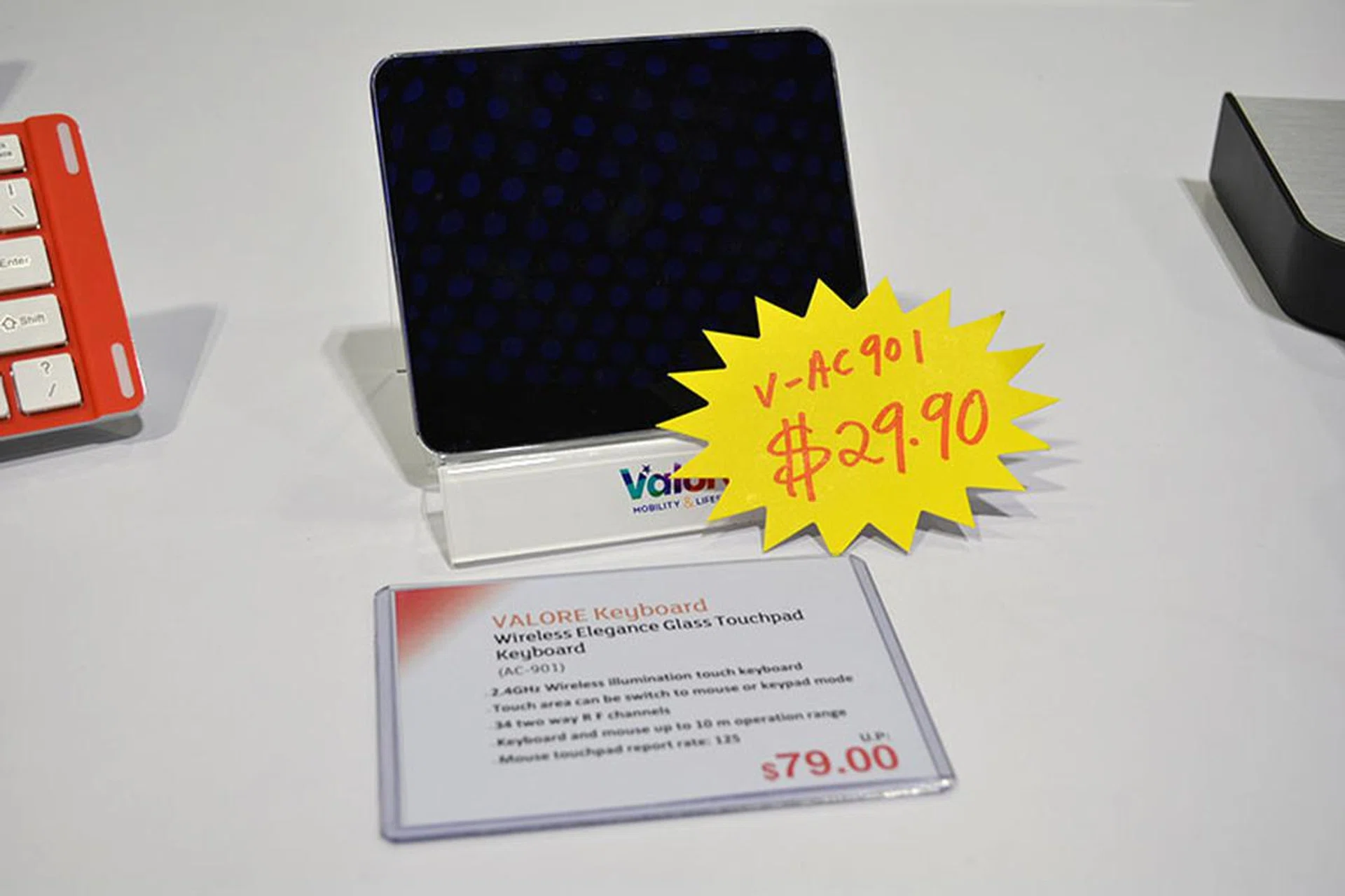 The Valore Wireless Elegance Glass Touchpad Keyboard is a 2.4GHz wireless illumination touch keyboard. It can switch between mouse and keypad mode with a single swipe and has up to a 10m operating range, giving you total wireless freedom. You can get it now at Valore's booth for $29.90 (usual price $79).