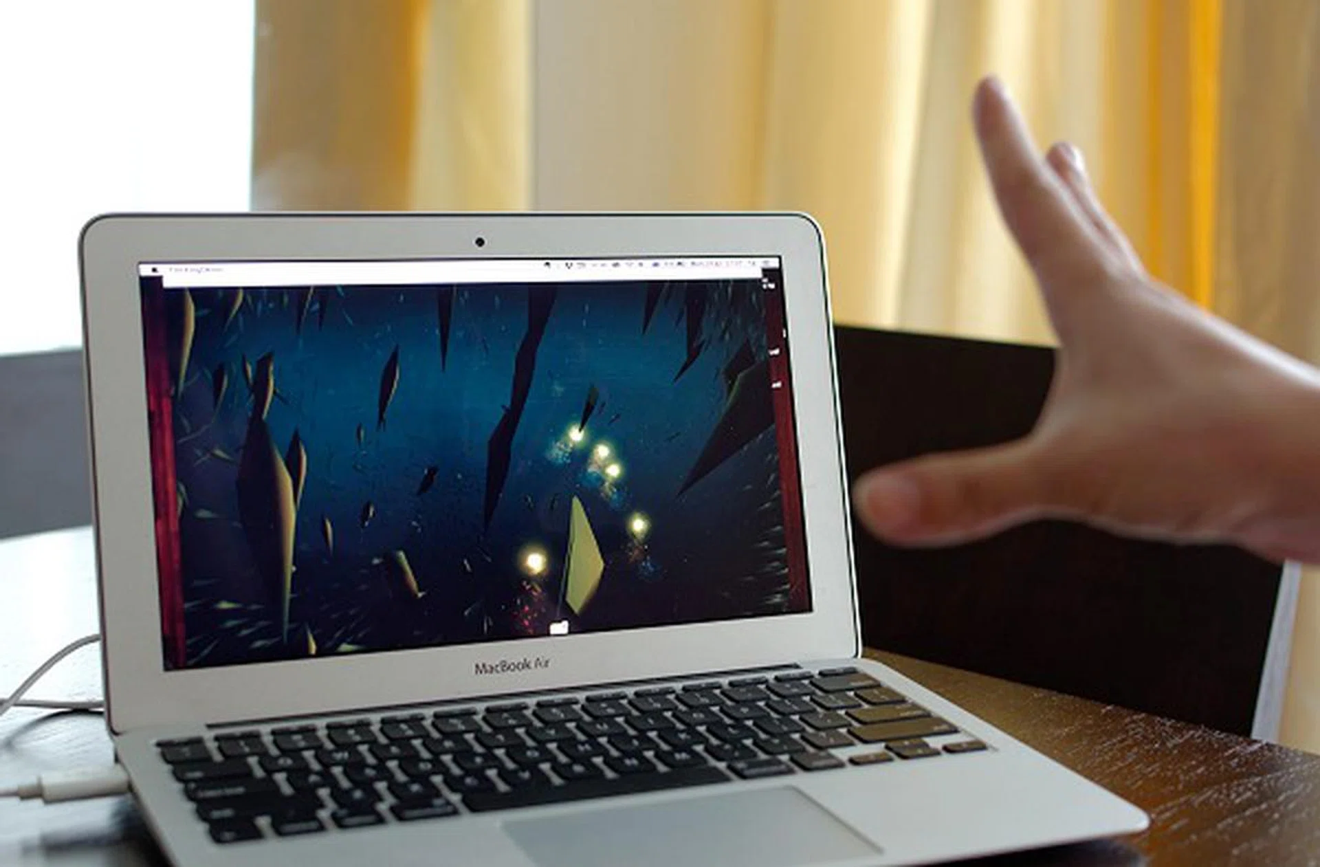 Then there are other apps like Flocking that does not much else other than summoning a school of fish to follow light sources that are at the tip of your fingers.