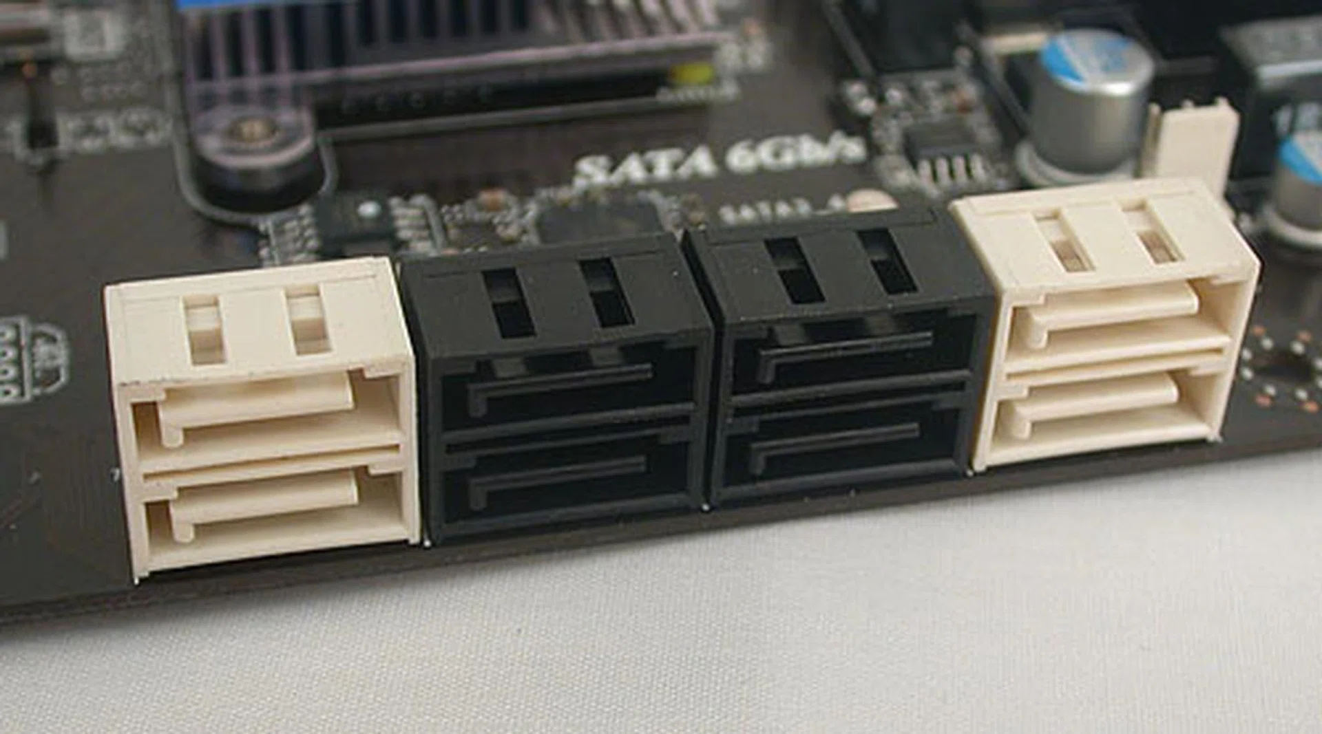 The SATA ports in white are SATA 6Gbps capable, with two from the Intel chipset and the other two from a Marvell controller. The ones in black are standard SATA 3Gbps connectors from the P67 chipset.