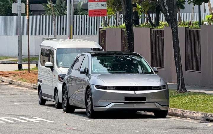 Currently, motorists pay for roadside parking using paper parking coupons or the Parking.sg app. Photo: HWZ