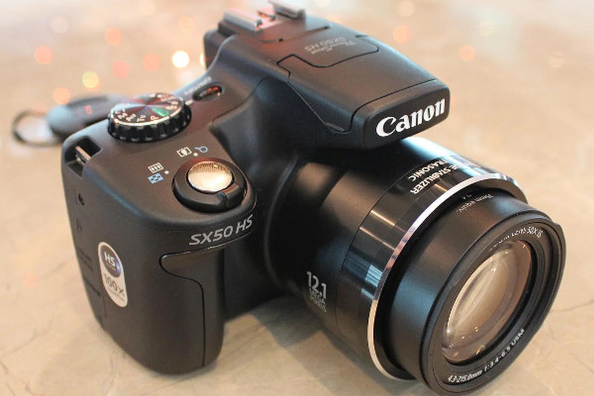 The SX50 sports a curved, DSLR-like hand grip for better handling. Needless to say, a better grip will lessen the chance of hand shake.