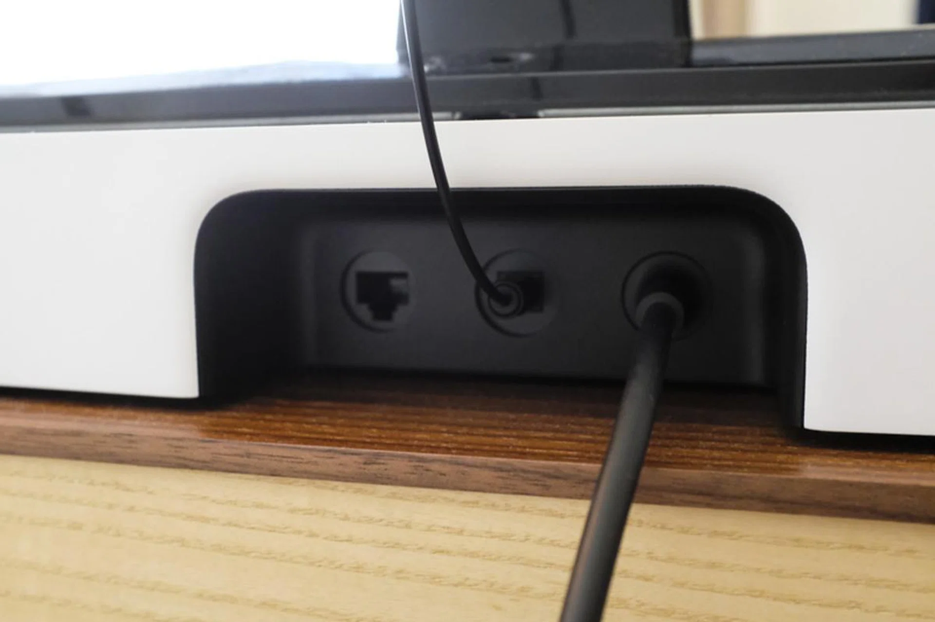 A single optical cable connects the Playbase to your TV.