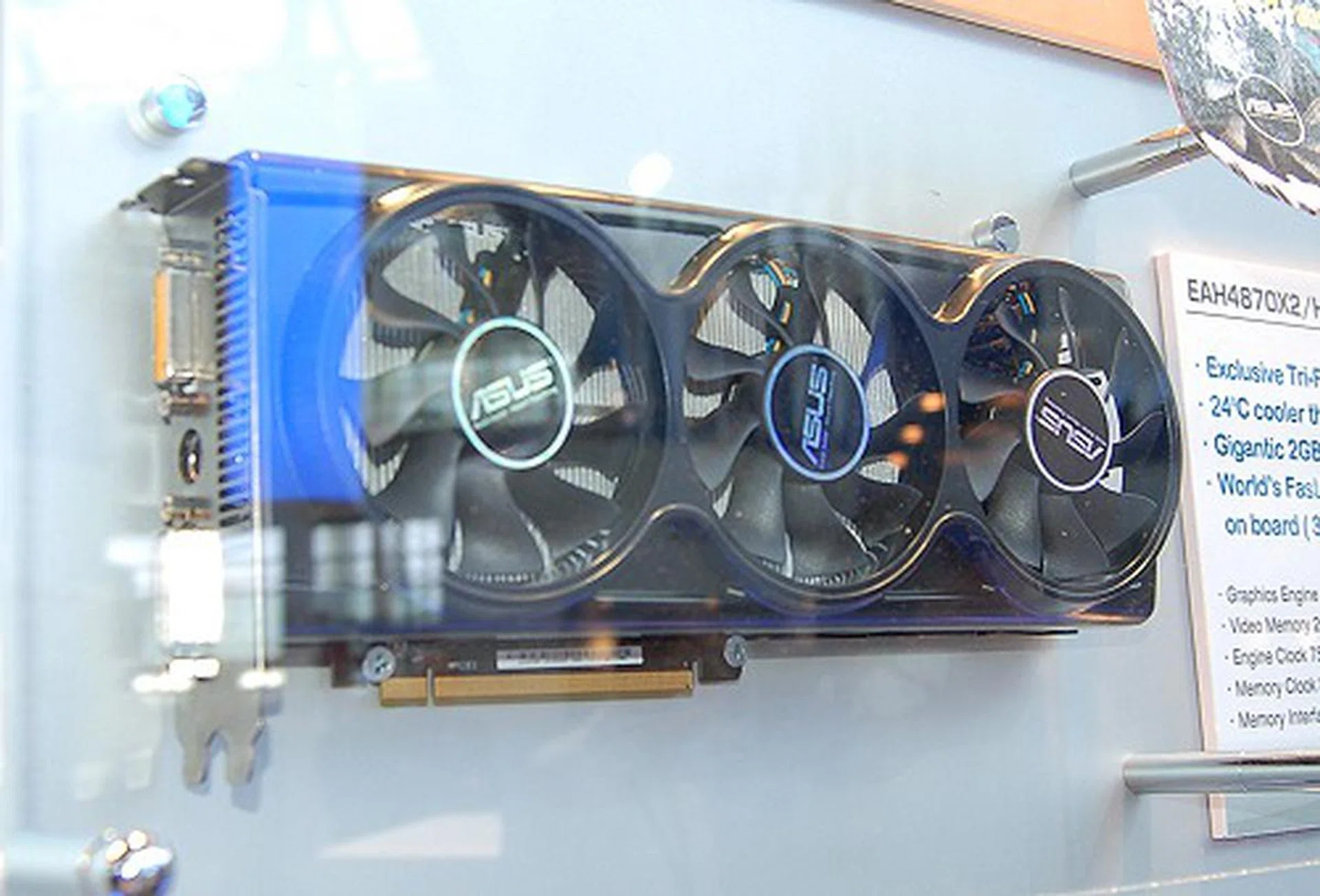  Here's the EAH4870X2/HTDI/2G graphics card sporting a custom tri-fan cooler. According to ASUS, this model is up to 24 degrees cooler than the reference Radeon 4870 X2 design. Clock speeds are 750/3600MHz DDR.  