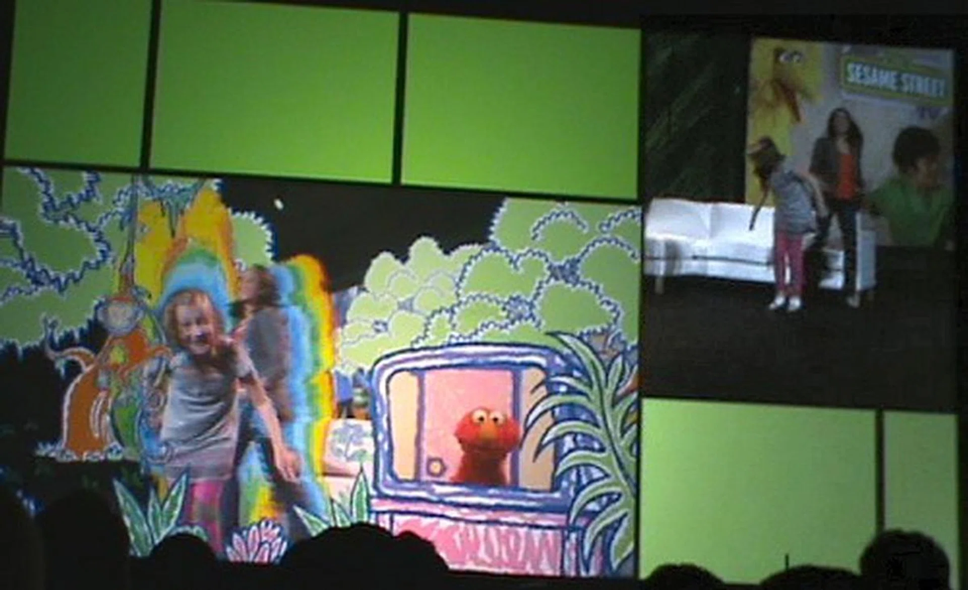 Guest stars trying out an interactive Sesame Street TV program that's under works. You can see the guests in the top right corner interacting and the foreground focus is what they actually see. We know it looks like a game, but it's a TV program as Microsoft puts it. Perhaps more insight will be shared closer to it release date on how it works different from a stored game.