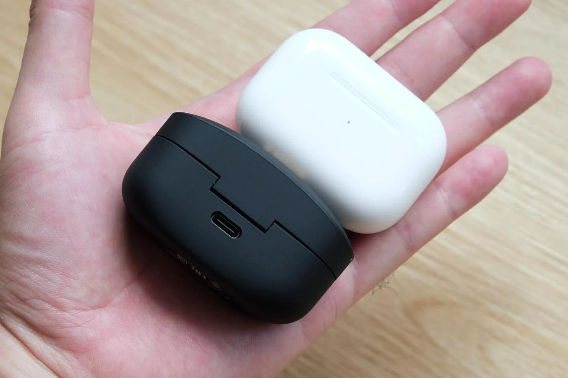 The charging case is a lot more compact. Here it is next to the AirPods Pro's.