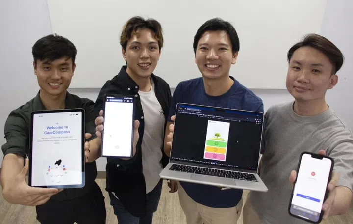 The teams behind the CareCompass (from left: Joshua Gei and Isaiah Tan) and Heartbeat (from right: Chen Zhihan and Royce Hoe) apps. Photo: The Straits Times. 