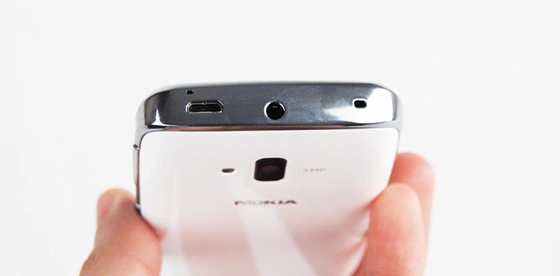 Seen here are the micro-USB port, 3.5mm audio output jack and the lanyard eyelet.