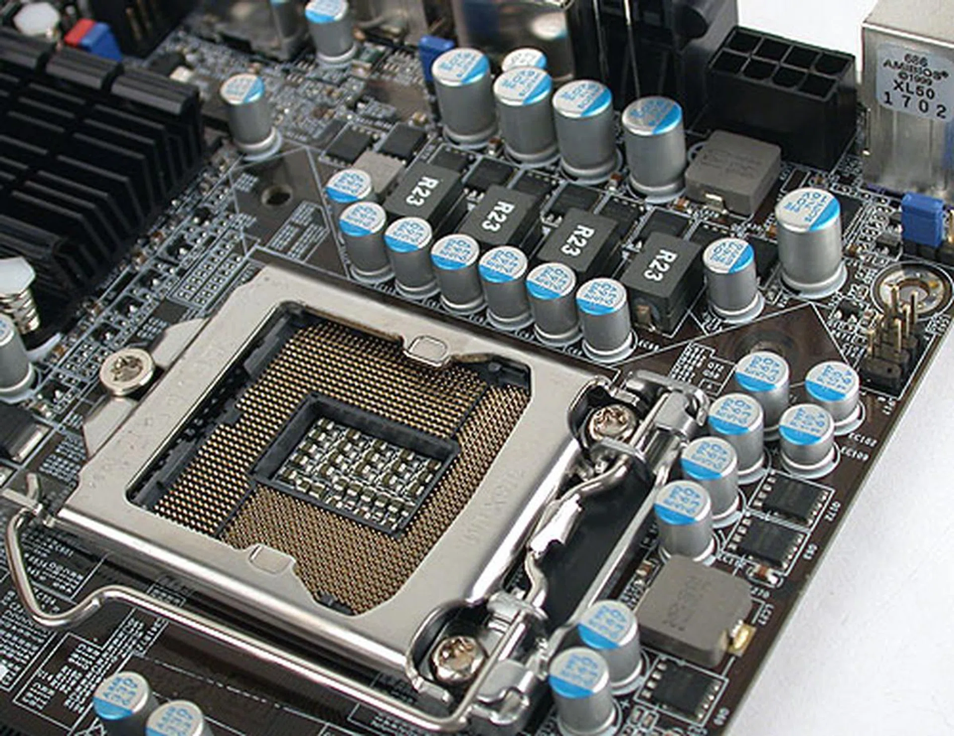 Solid capacitors surround the CPU socket (with six phase digital PWM) but there's no space for additional passive heatsinks for the nearby components. 