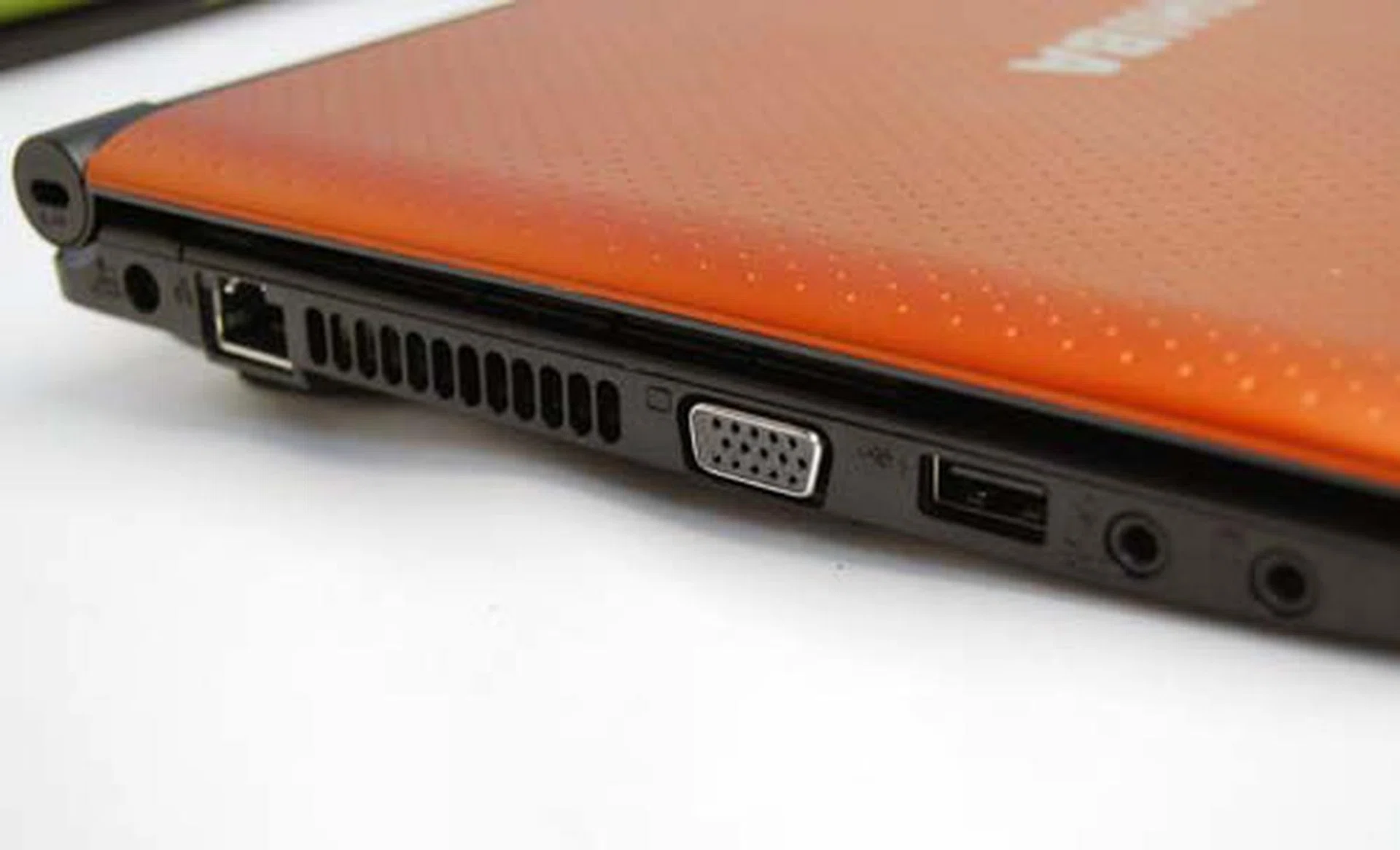 On the left side, you'll find the LAN port, a VGA output, another USB port and the audio jacks. Note too, the slim profile of the netbook. Also, the AMD version has a HDMI port instead of a VGA-out port.