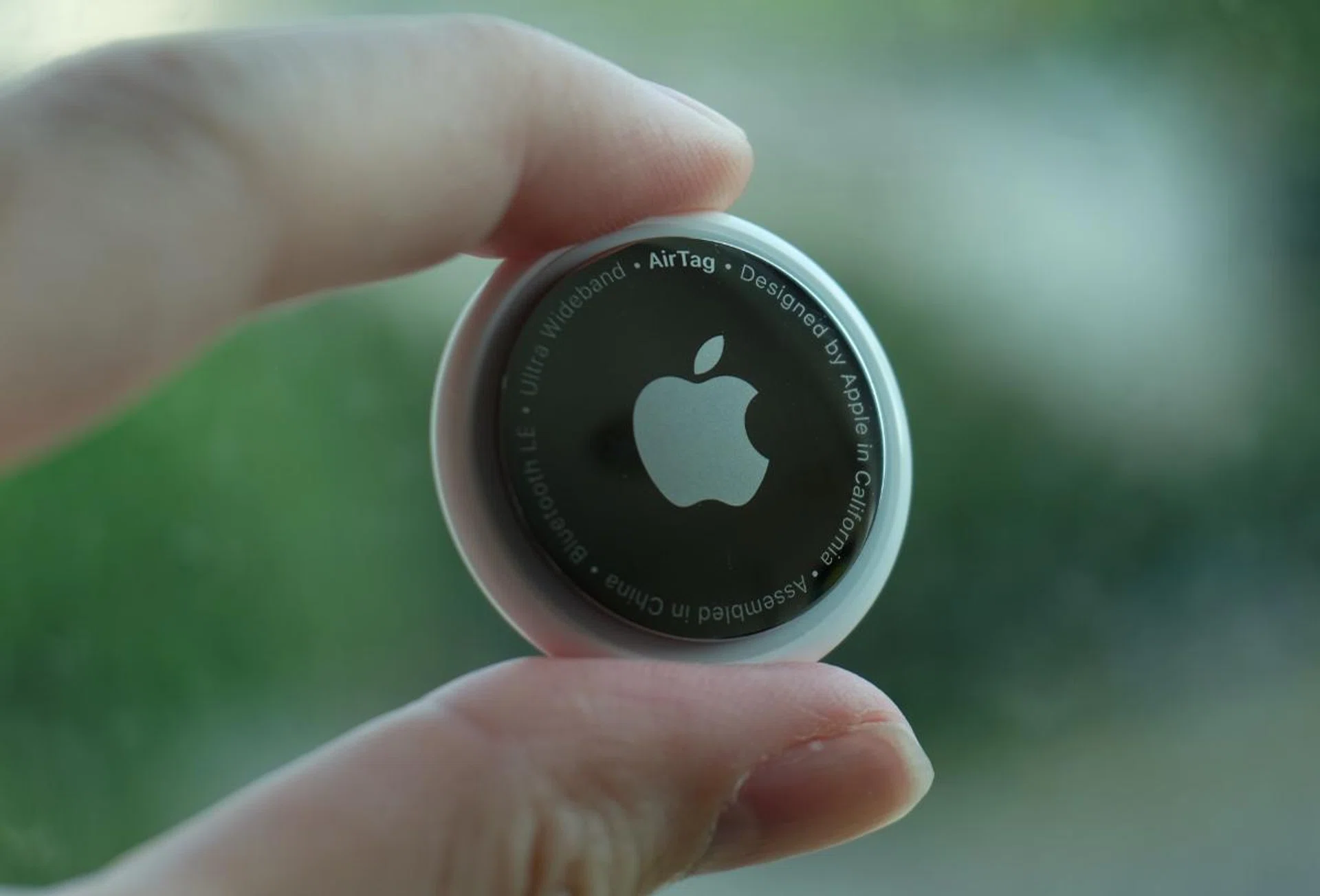 The AirTag is the size of a very large coin.