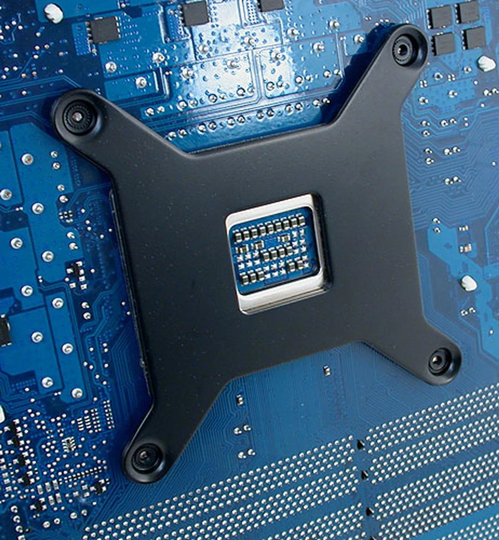The custom backplate that needs to be attached to the bottom of the motherboard. There are two included, one for LGA1366 and another for LGA775. AMD users have to get theirs from Corsair technical support for a nominal shipping fee. 
