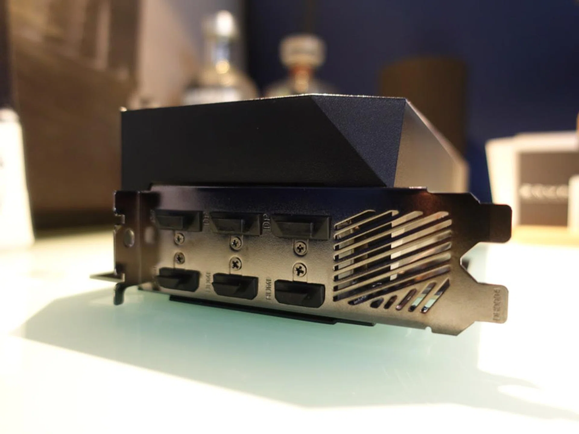 The card features an impressive number of HDMI and DP ports. It also occupies a staggering four expansion card slots.