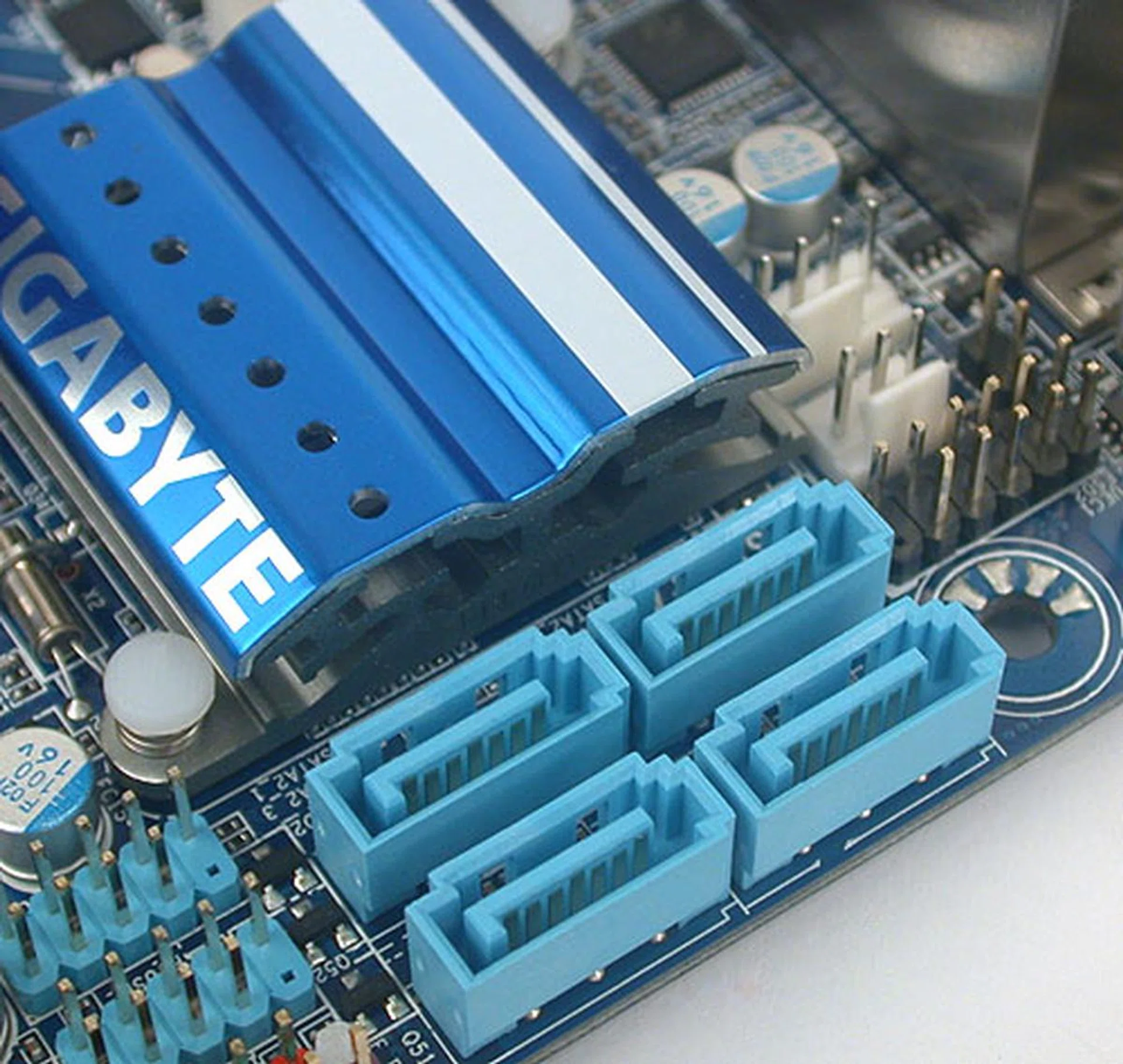 Four SATA 3Gbps ports are found near the PCH. There's obviously no space for Gigabyte to add a SATA 6Gbps controller.