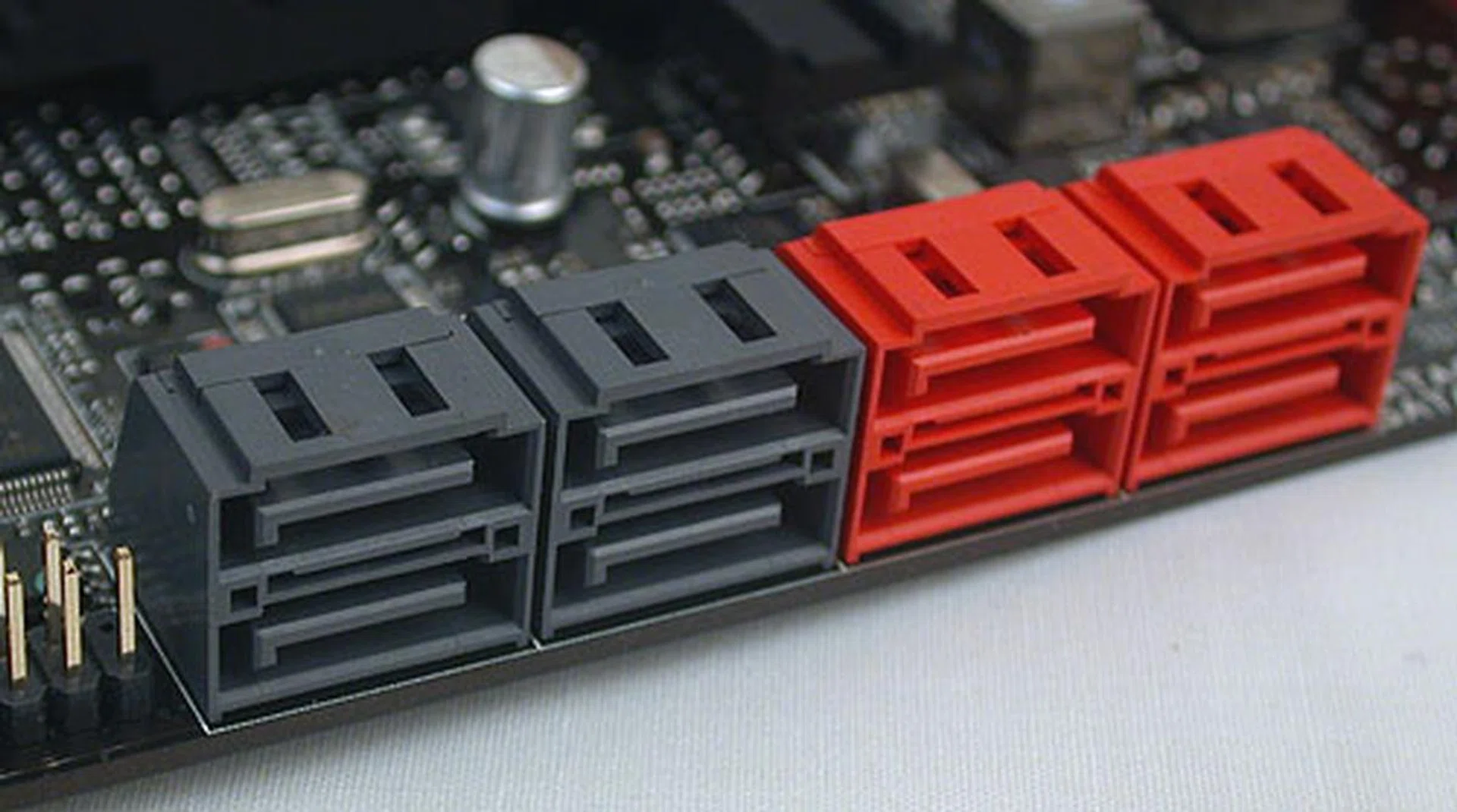 Eight SATA ports, of which the four red ones are SATA 6Gbps. Two from the Intel chipset and two from a Marvell 9182 controller.