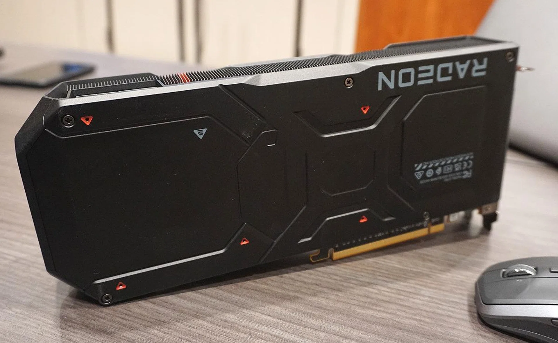 A thick aluminium die-cast backplate helps improve the PCB rigidity (and adds to the weight too). Overall, you'll note that the heat from the card will be exhausted back into the chassis, which is also where the triple fans force-feed air from the chassis to cool the card. It remains to be seen how well this air cooler design can cope with high-performance graphics cards in a sealed chassis environment, which we fully intend to find out in due time.