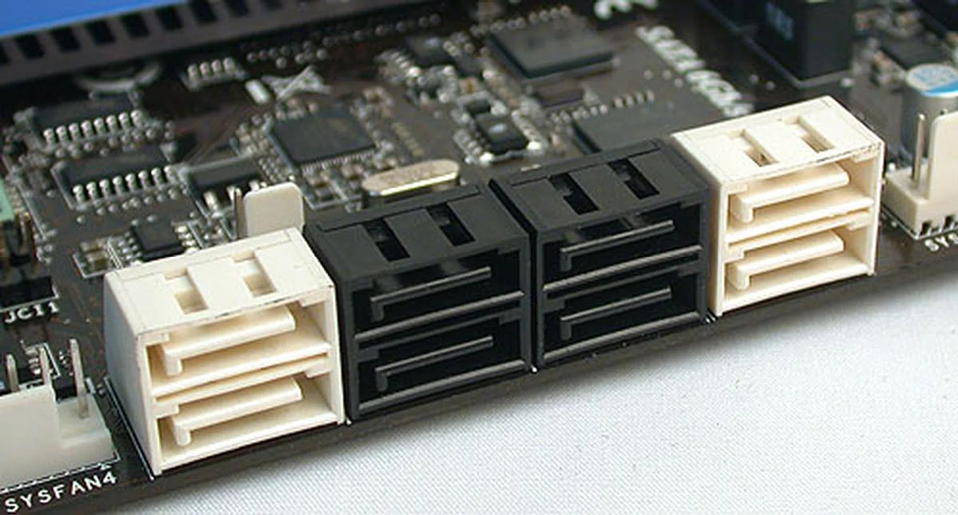 The white SATA ports here are SATA 6Gbps while the black ones are SATA 3Gbps. However, unless you have the manual, it's not clearly marked which SATA 6Gbps ports are from the Intel P67 chipset and which ones are from the additional Marvell controller. Ans: the rightmost pair of white ones are from Intel.