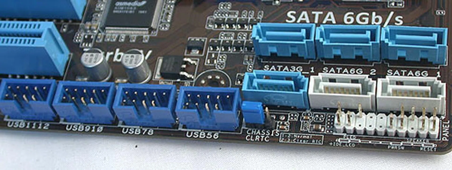 We are not fans of SATA ports that point skywards, but given that they are unlikely to interfere with your add-on cards at their current location, we can give it a pass. The ones in blue are SATA 3Gbps and the white ones are the newer SATA 6Gbps. There are also plenty of USB headers and the jumper to clear the CMOS. 