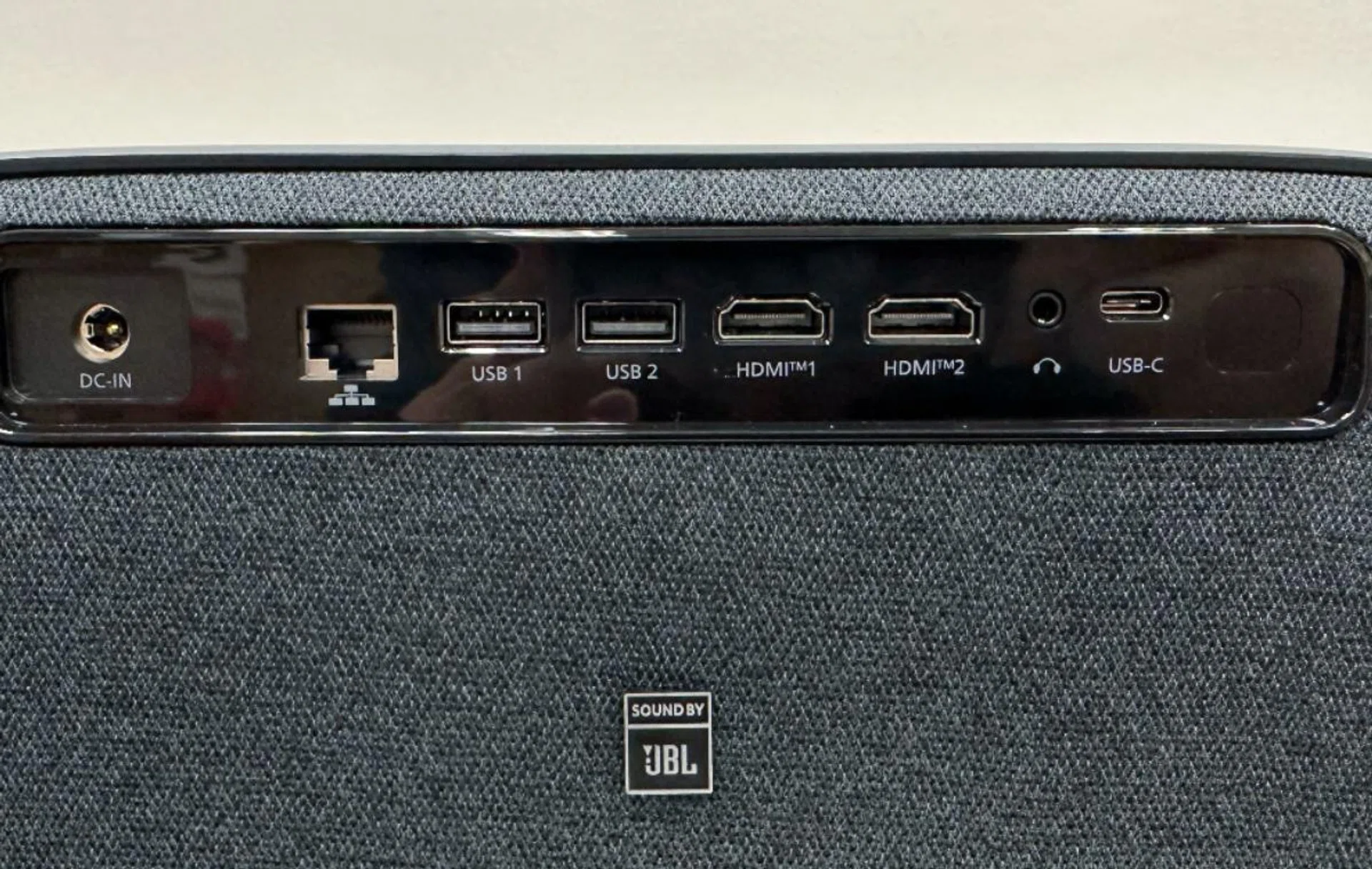 Below the connections on the rear, you can find a "Sound by JBL" label. 
