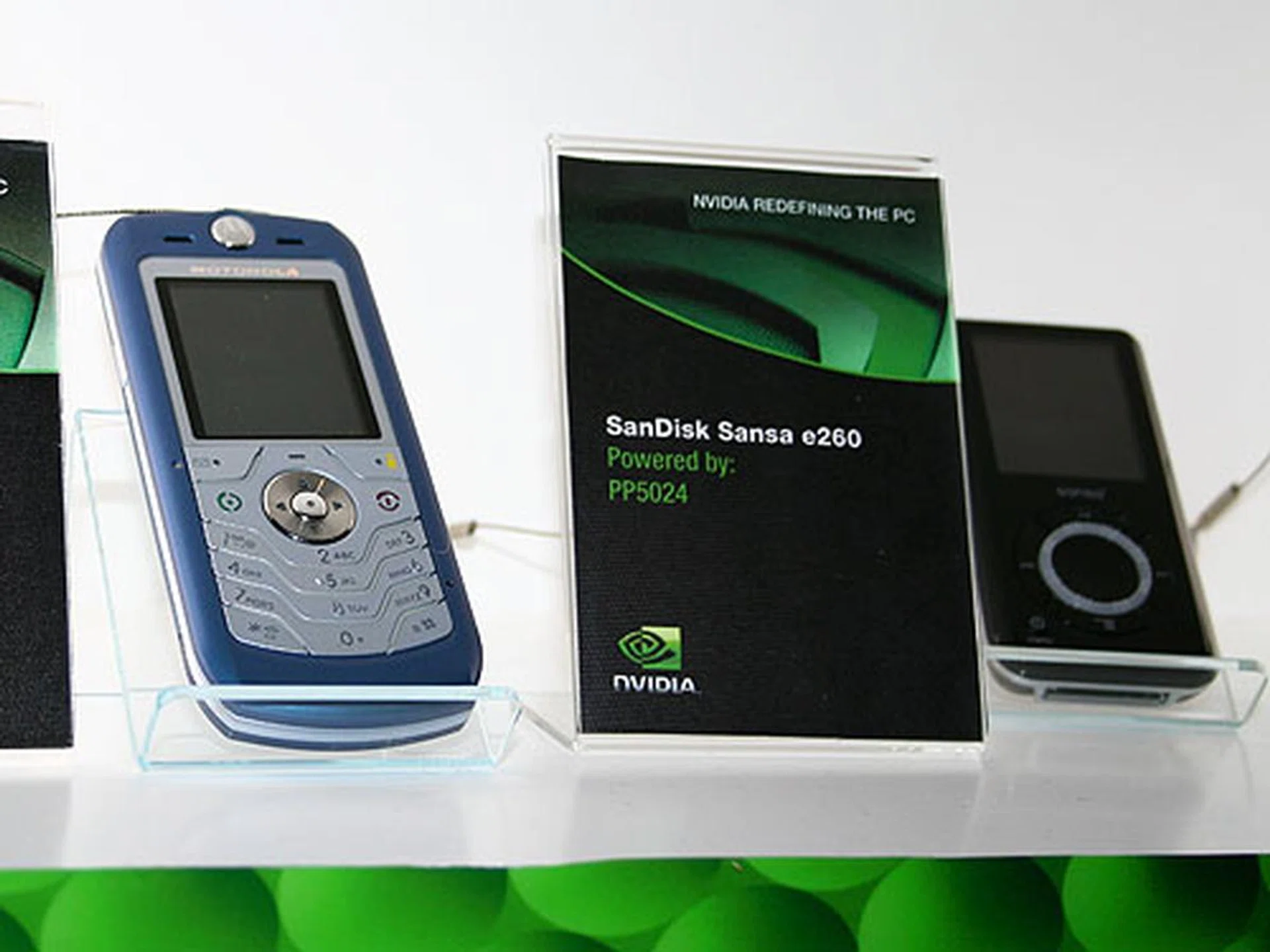  The Motorola L6i (left) also uses NVIDIA's media accelerator (the GoForce 2150) while the Sandisk Sansa e260 (right) MP3 player uses NVIDIA's PP5024.  