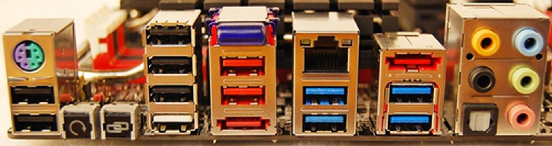 Located diagonally opposite the SATA connectors are the backpanel I/O ports. There is a Bluetooth v2.1+EDR module just above the pair of red USB 2.0 ports. The red port below the pair is the eSATA 6Gbps port. The button with the chainlink logo is the ROG Connect button that toggles your input keyboard to work with the OSD based menus from the OC Key (more on that later).