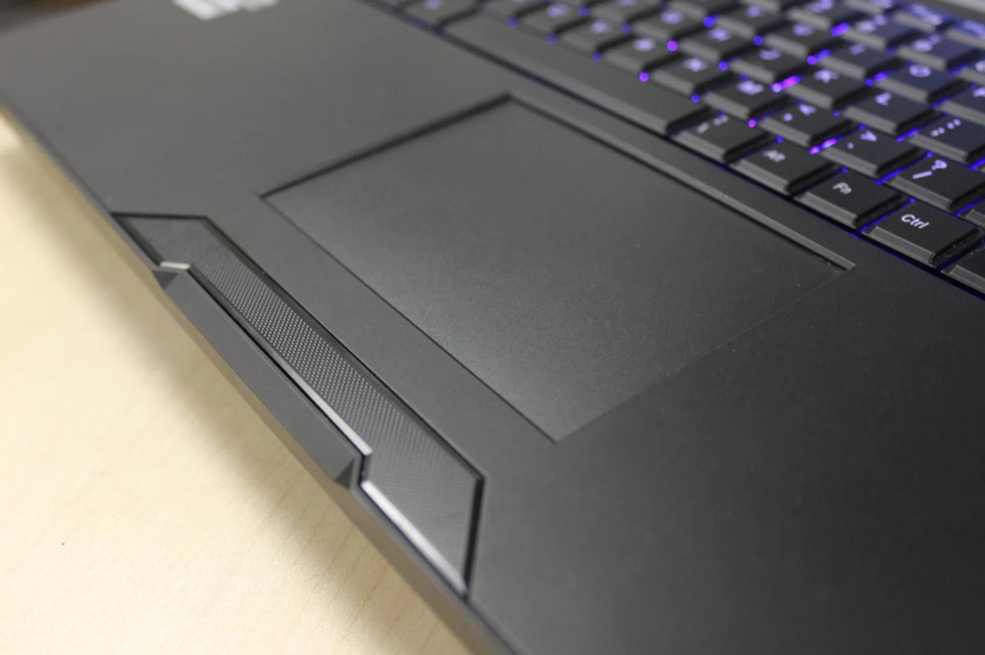 The clickpad has been replaced with a conventional trackpad this time. You can either tap on it to register mouse clicks, or if you prefer, you can use the grilled part of the chassis as physical mouse buttons.