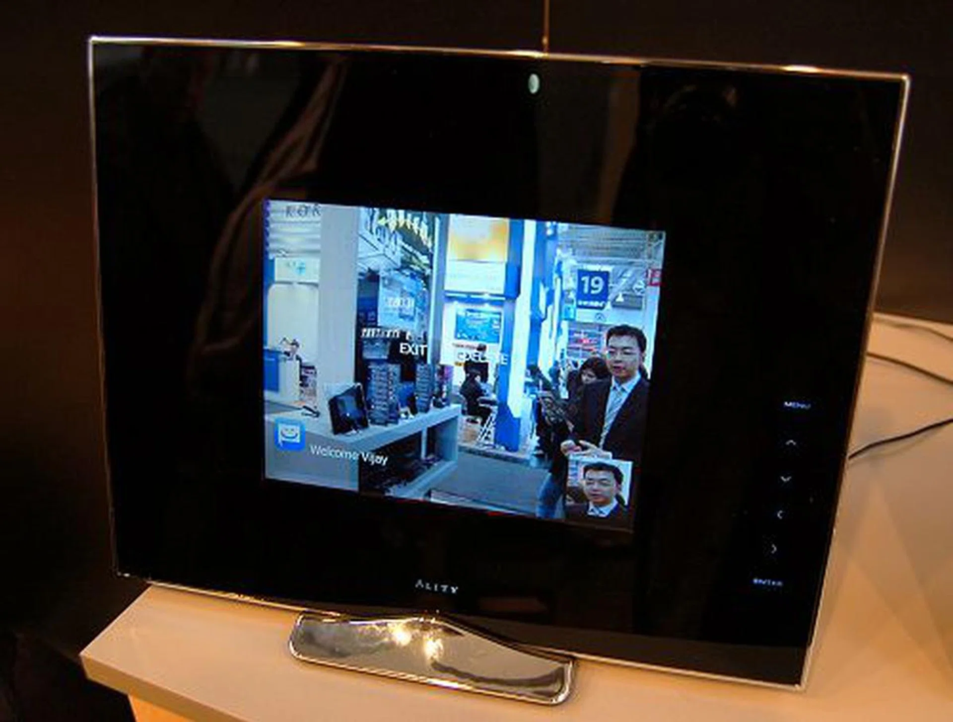  Based on a user account service, you can send messages, photos and even chat with friends from your Pixxa or Ality online account with that of your friend's Pixxa account. News and live feeds of your interest are displayed on the screen after the initial configuration while Live Calendar synchronizes your schedules from Google Calendar to the Wireless Pixxa (or vice versa). In a live demonstration of the Photo Messenger, the demo personnel sent an e-mail message with a photo using his Pixxa account to the test unit's account and the picture message came up in a jiffy. The Wireless Pixxa demoed here is a prototype model and its physical frame would be smaller yet in the final unit. Overall, we feel this gadget has potential to even give the HP Touchsmart PC a competition for those who require nifty and simple collaboration device without requiring an entire PC. It even supports multiple user accounts!  