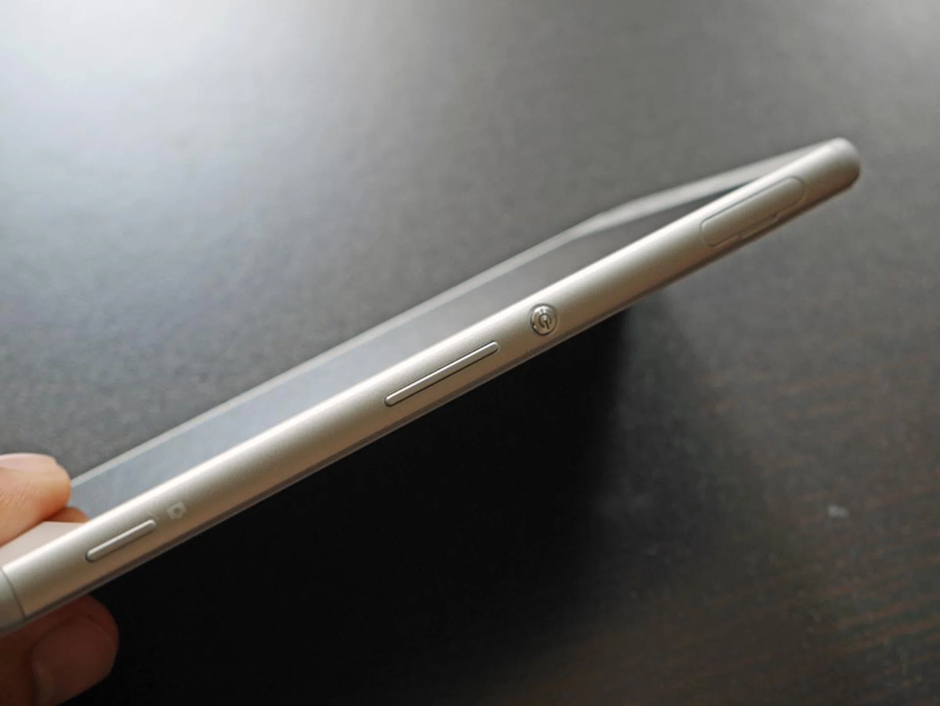 The Xperia M4 Aqua comes with a dedicated camera button (left), which sits below the volume rocker.