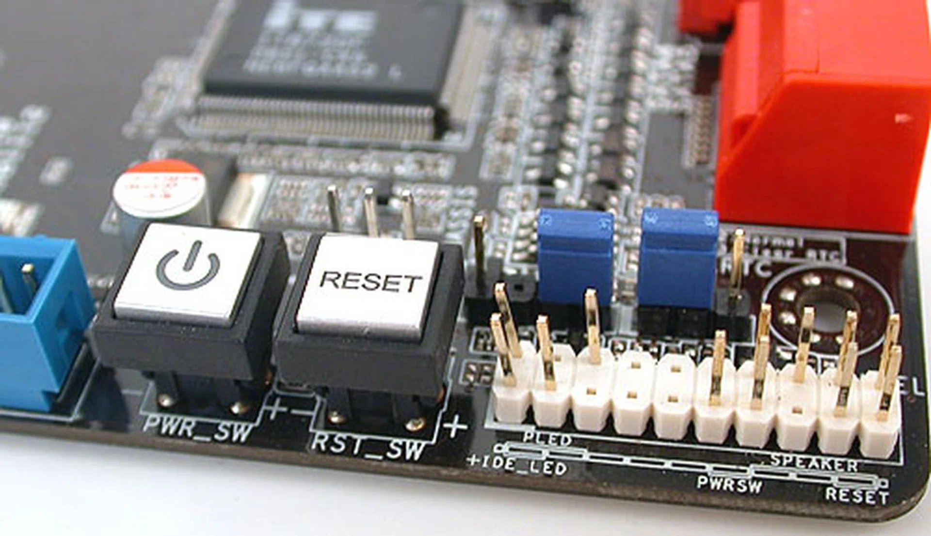 We only found power and reset buttons onboard; the clear CMOS option was surprisingly through the traditional jumper. 