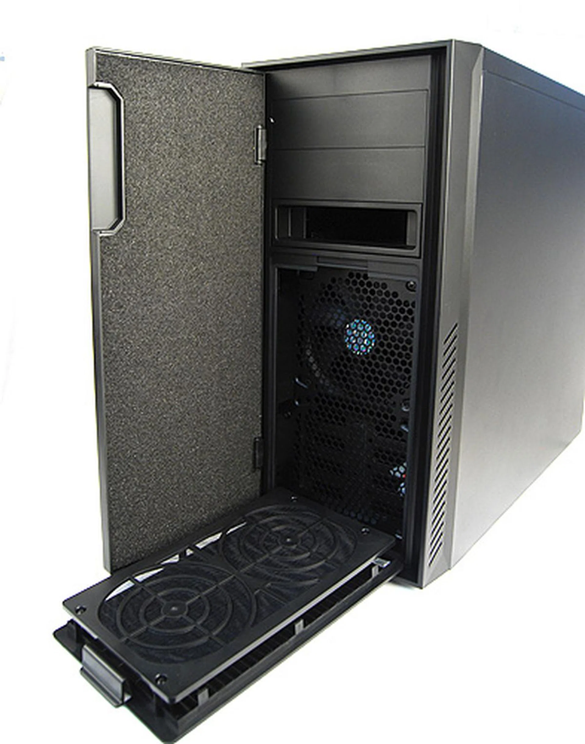 The front panel is held in place by hidden magnets. Note the thick sound dampening foam. Opening it reveals the two 5.25-inch external drive bays and hot swappable X-dock. Lastly, the dust filters for the front fans can be easily removed for cleaning. 