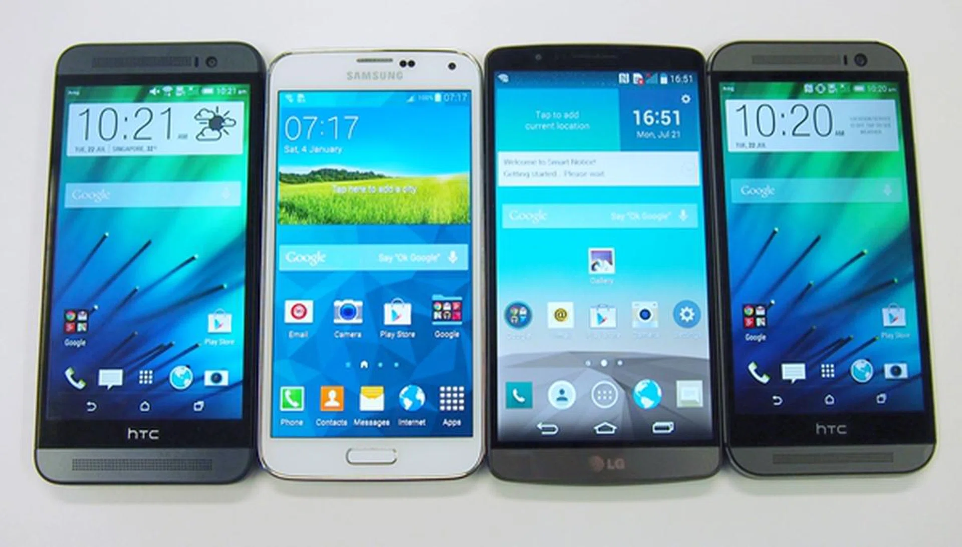 The front view of the phones. <br>From left to right: HTC One (E8), Samsung Galaxy S5, LG G3, HTC One (M8).