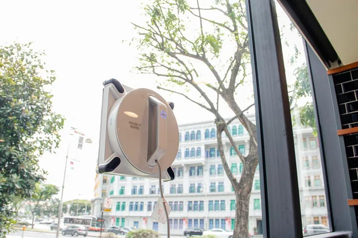 The Winbot 950 uses a suction fan to stay attached to the window it’s cleaning.