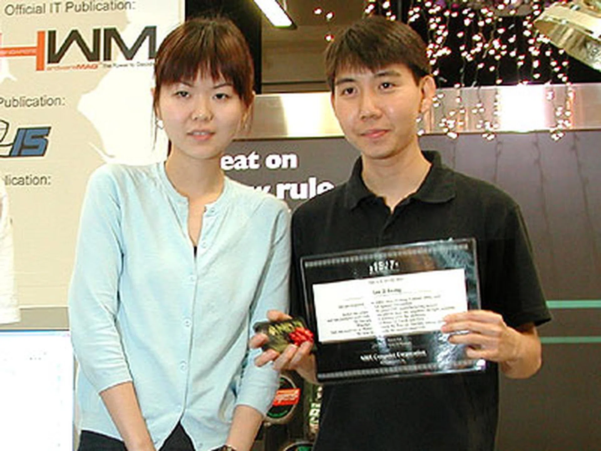 The winner for the open category was Shamino (seen here posing with Maggie Lin - the Marketing Manager for ABIT). Shamino had a perfect score of 50.