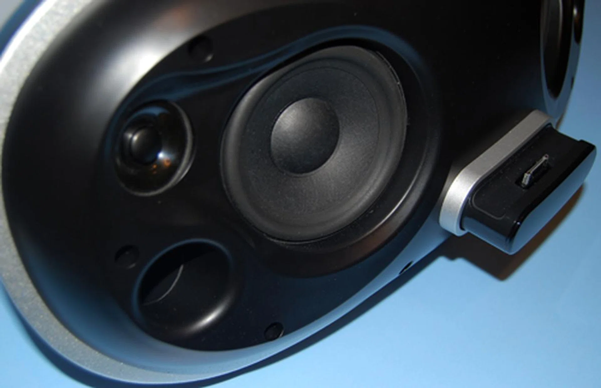 A closer inspection reveals a 3-inch driver and bass reflex port intended to help provide a bit more ambiance to the lower frequencies.