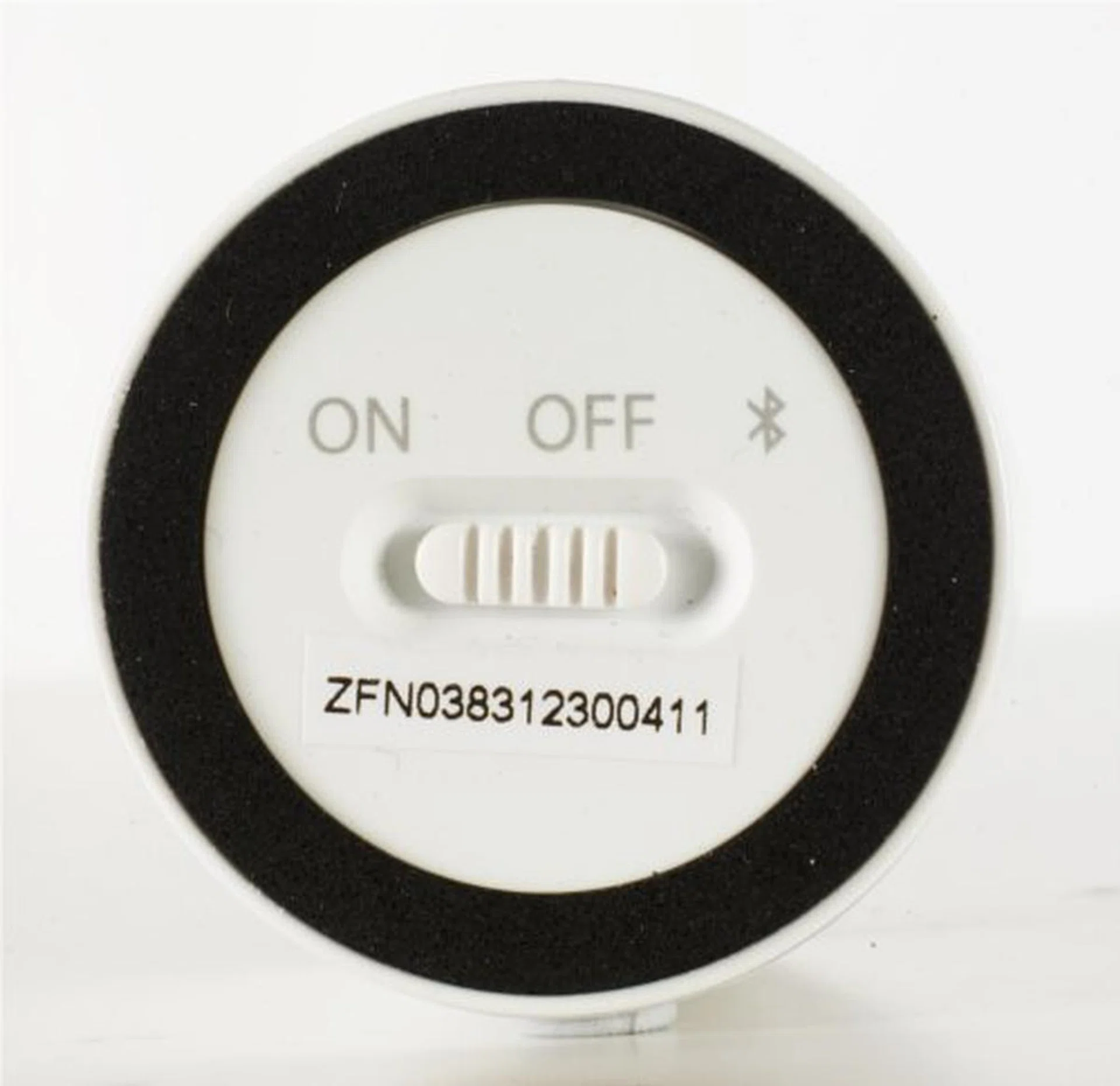 Flipping the speaker over reveals the on/off/Bluetooth switch at the base.