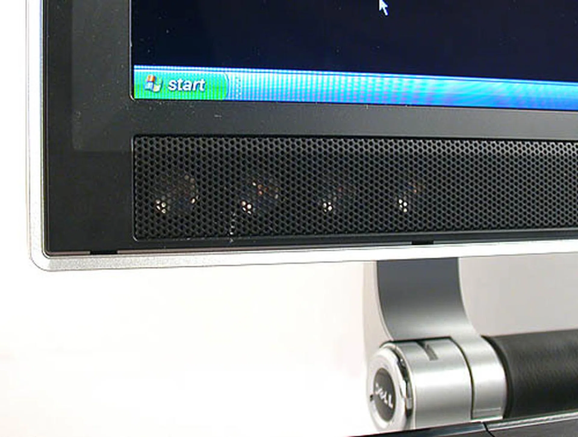 There are eight integrated speakers (micro drivers), four on each side of the display. Here's four.