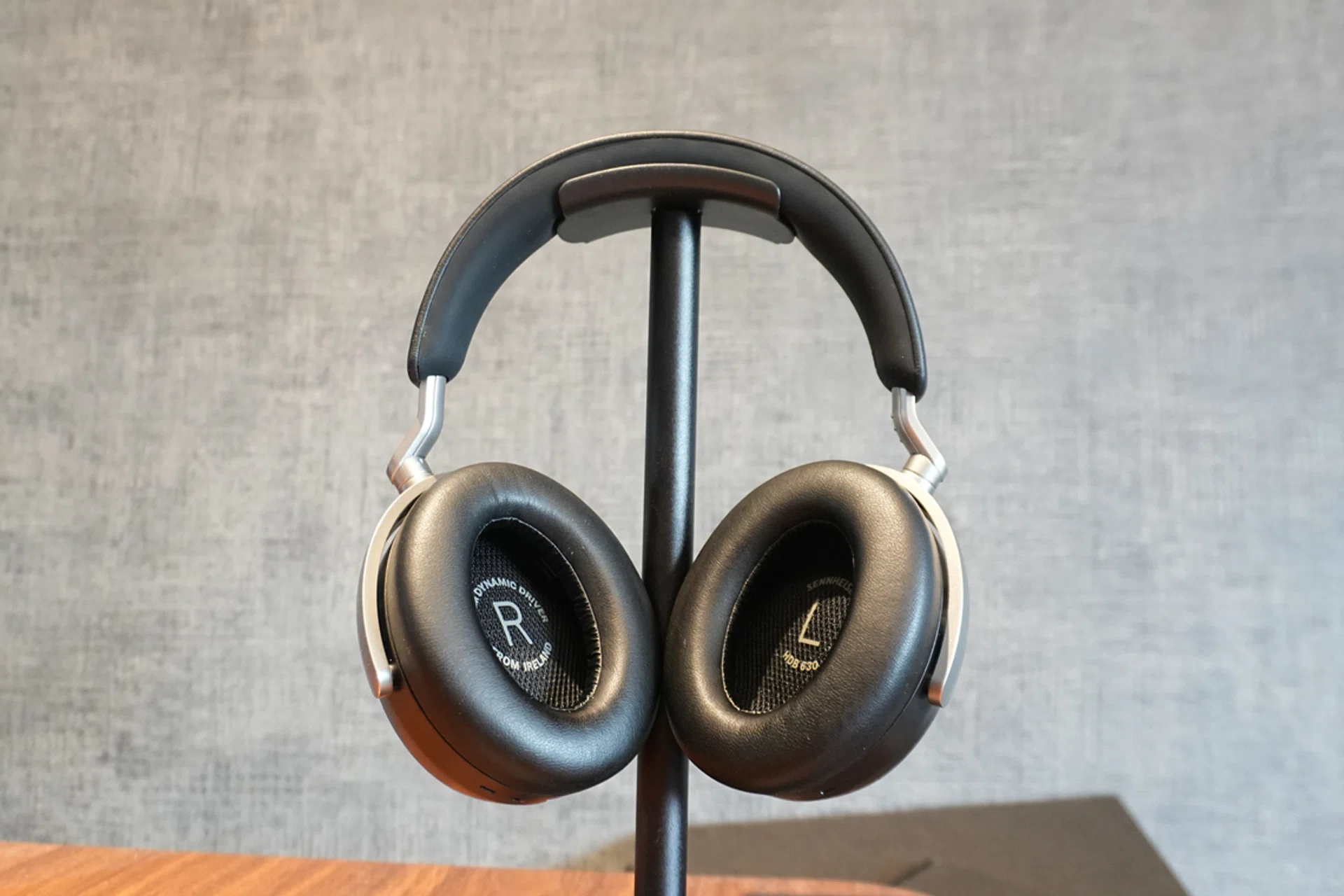 Mid shot of the Sennheiser HDB 630 on an headphone stand. 