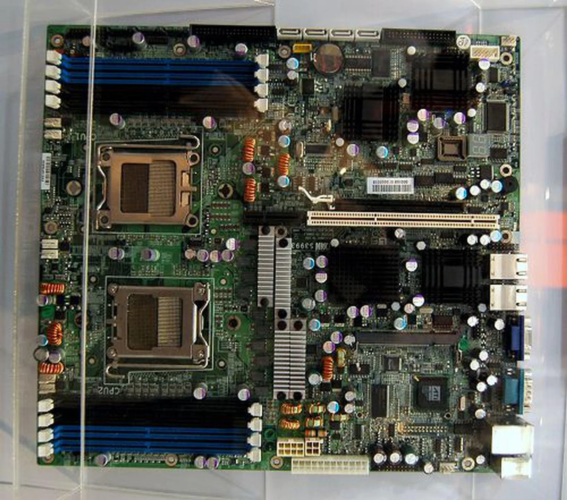  This is also a dual processor board for AMD's Socket F processors, but this Thunder h2100R is based on the Serverworks HT2100 + HT1000 chipset. It has only one PCIe x16 slot, one PCI-X slot and 8 DIMM slots for 32GB of maximum memory. Even storage options have been reduced to four SATA 3Gpbs ports and four SAS connectors. However, it maintains two Gigabit LAN ports and it even features an OPMA connector for an M2 OPMA card to support KVM over IP functionality.  