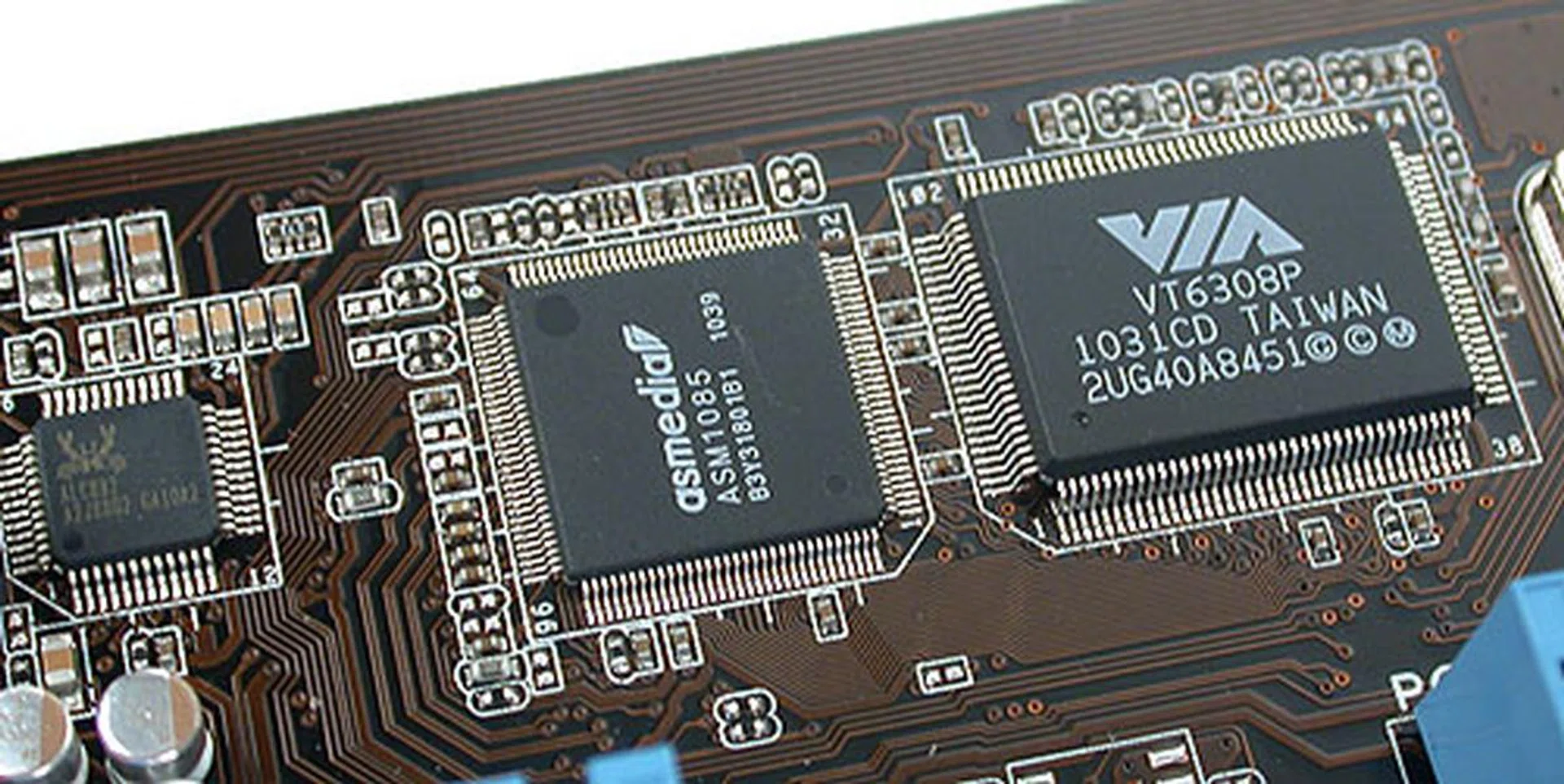 Some of the onboard modules on the ASUS P8P67; note that FireWire (VIA VT 6308P) is still supported.