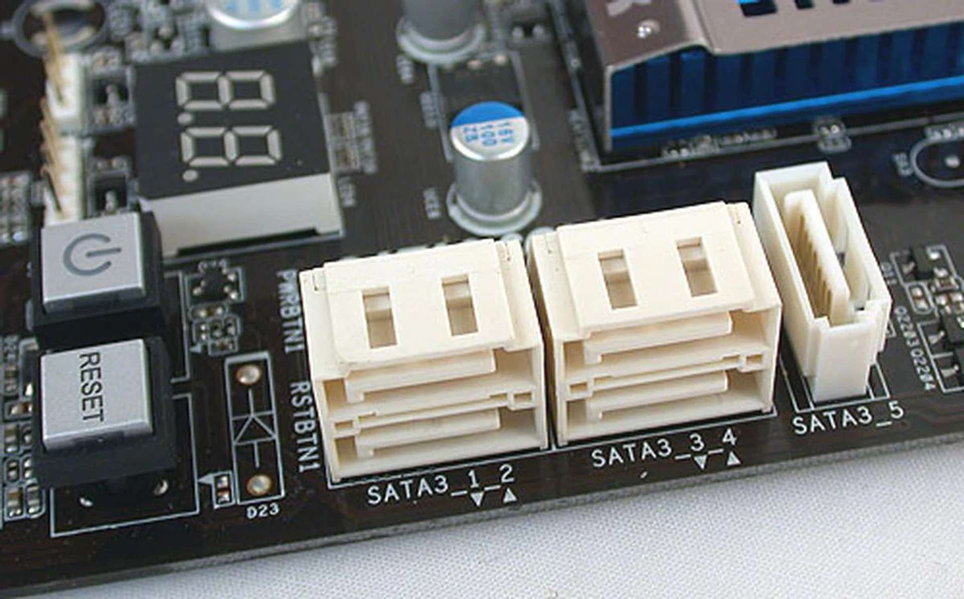There are only five SATA 6Gbps ports onboard; the sixth is the eSATA at the back. Onboard buttons for power and reset are also present, along with a debugging LED. 