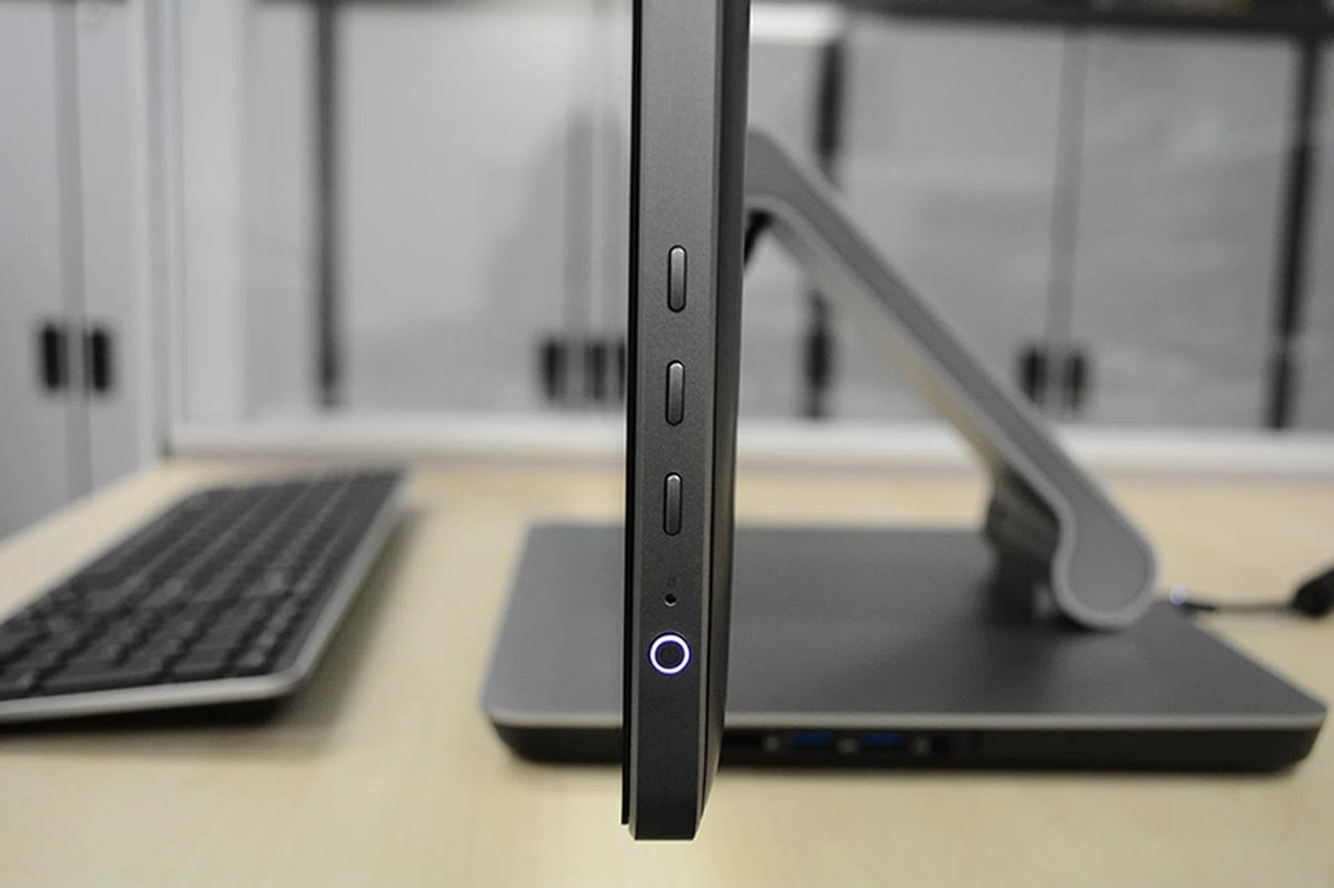 The power and OSD buttons are located at the right of the screen.