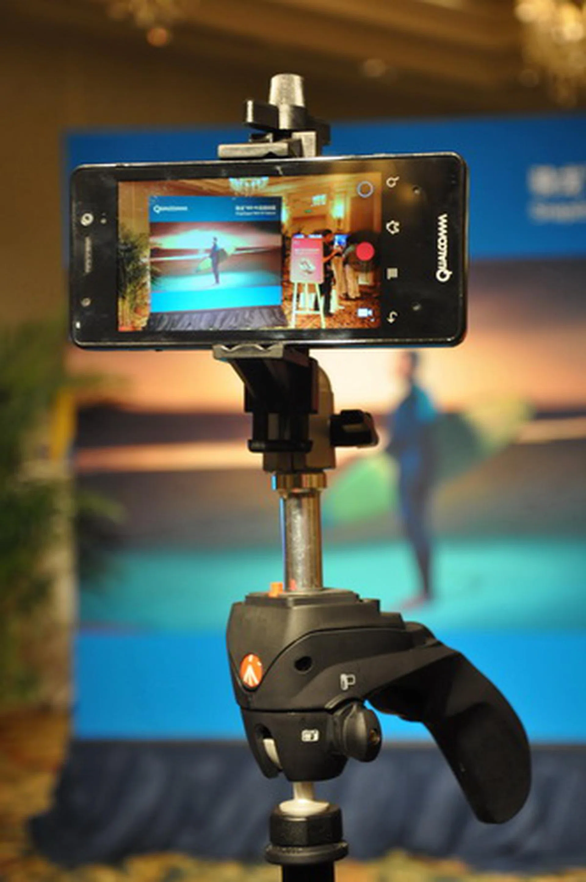 This prototype smartphone is mounted on a tripod to demonstrate the device's 4K Ultra HD video recording capability.