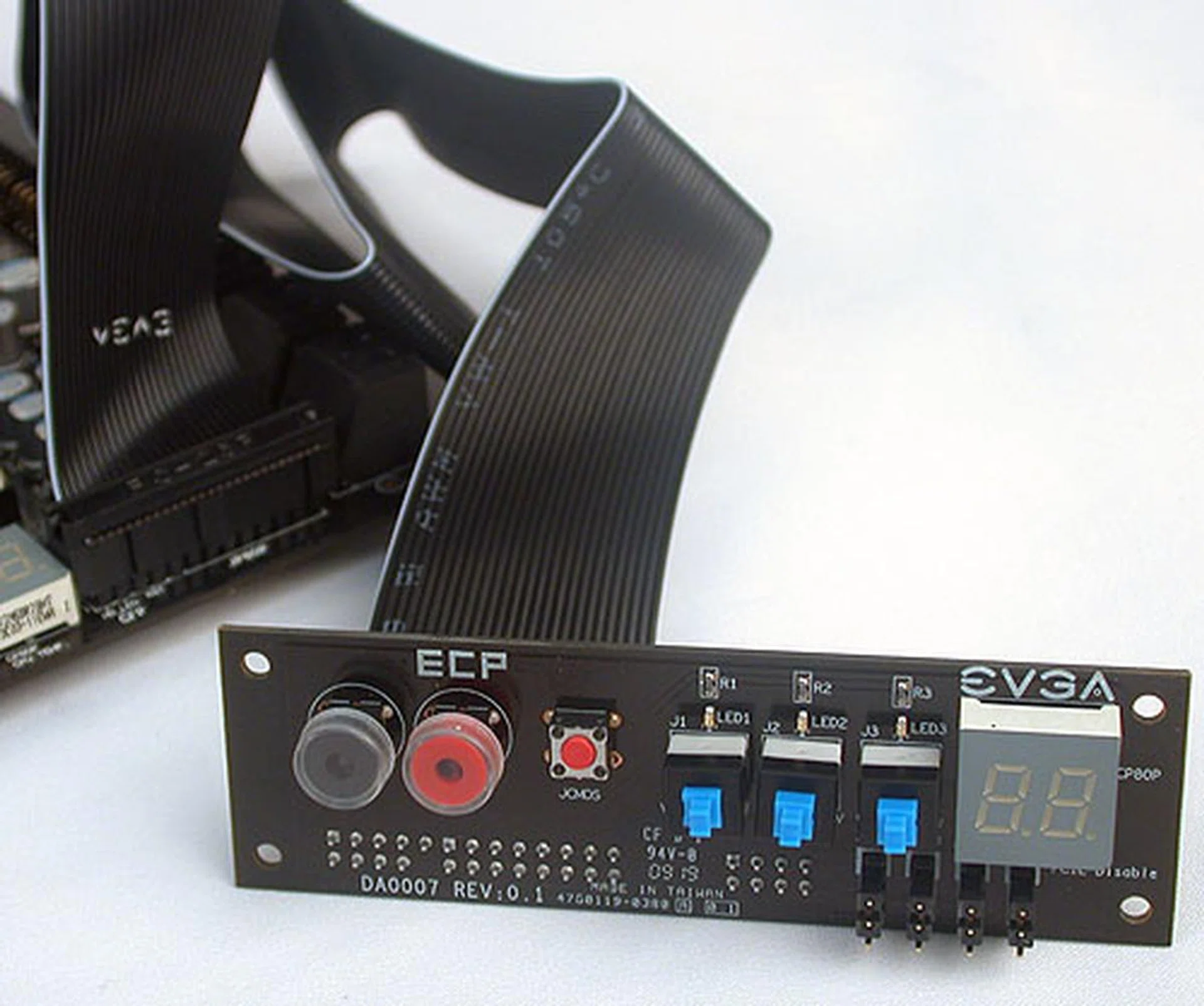 Meant for overclockers, EVGA's Control Panel is attached to the motherboard via a special cable included. The ECP as it's called allows users to access the basic power, reset and clear CMOS buttons, along with the PCIe slot Enable/Disable feature (requiring another cable to connect to the jumpers). There are also three buttons to boost the CPU VCore in real time, with each button increasing the VCore by 0.1V when pressed.