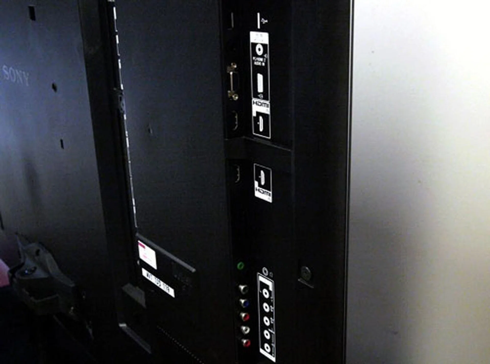 We like the way the side panel is aligned, but not so much its recessed positioning. Ensure there is sufficient gap between wall and panel for your fingers to fit through. The VGA and USB ports are located here.
