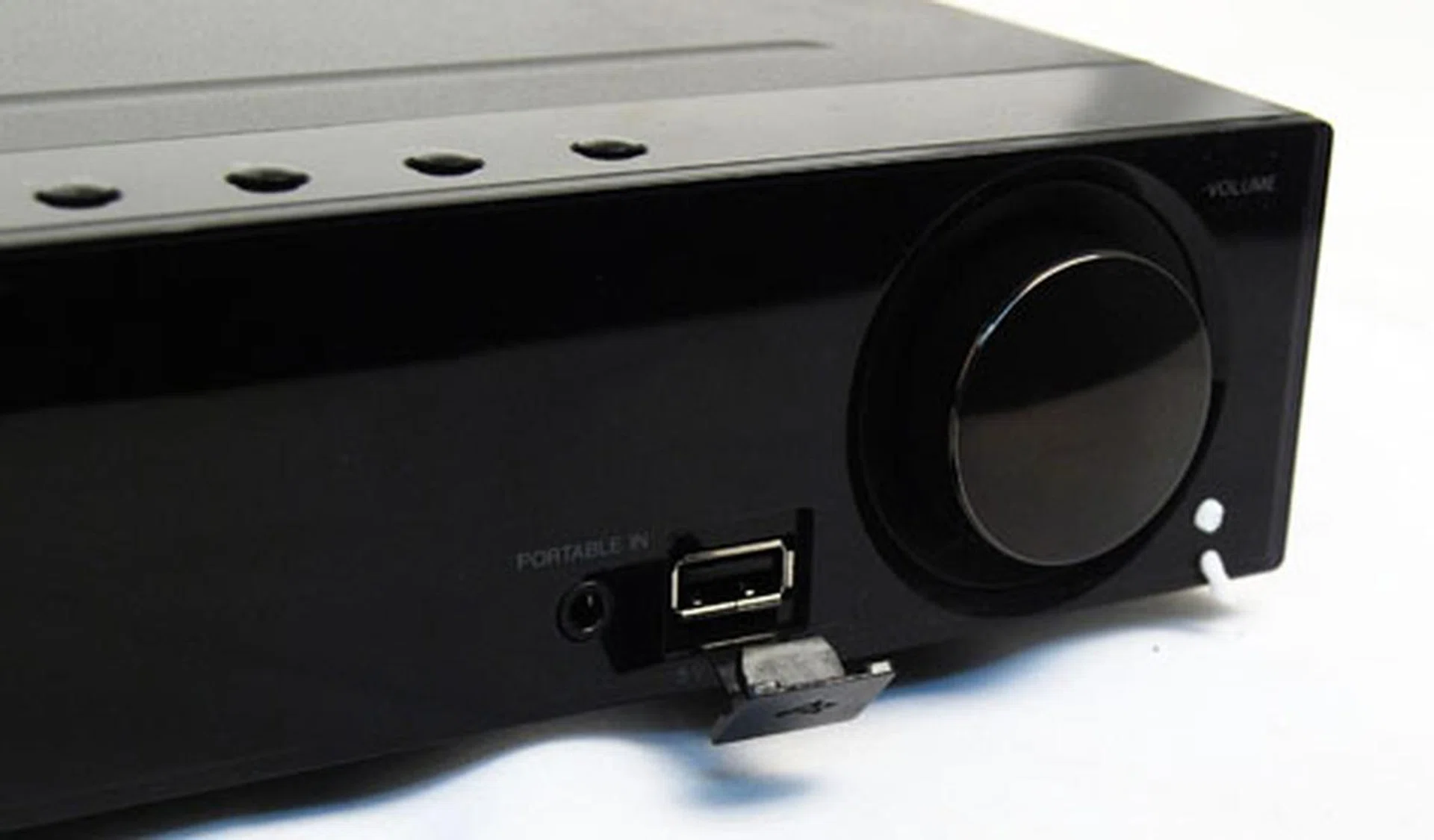 The USB port on the front next to the volume control is capable of providing playback for MP3s stored on your flash drive.