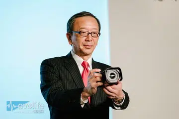 Canon China President & CEO Hideki Ozawa showing off the new camera.