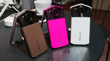 Casio EXILIM EX-TR70 in Gold, Pink, and White.