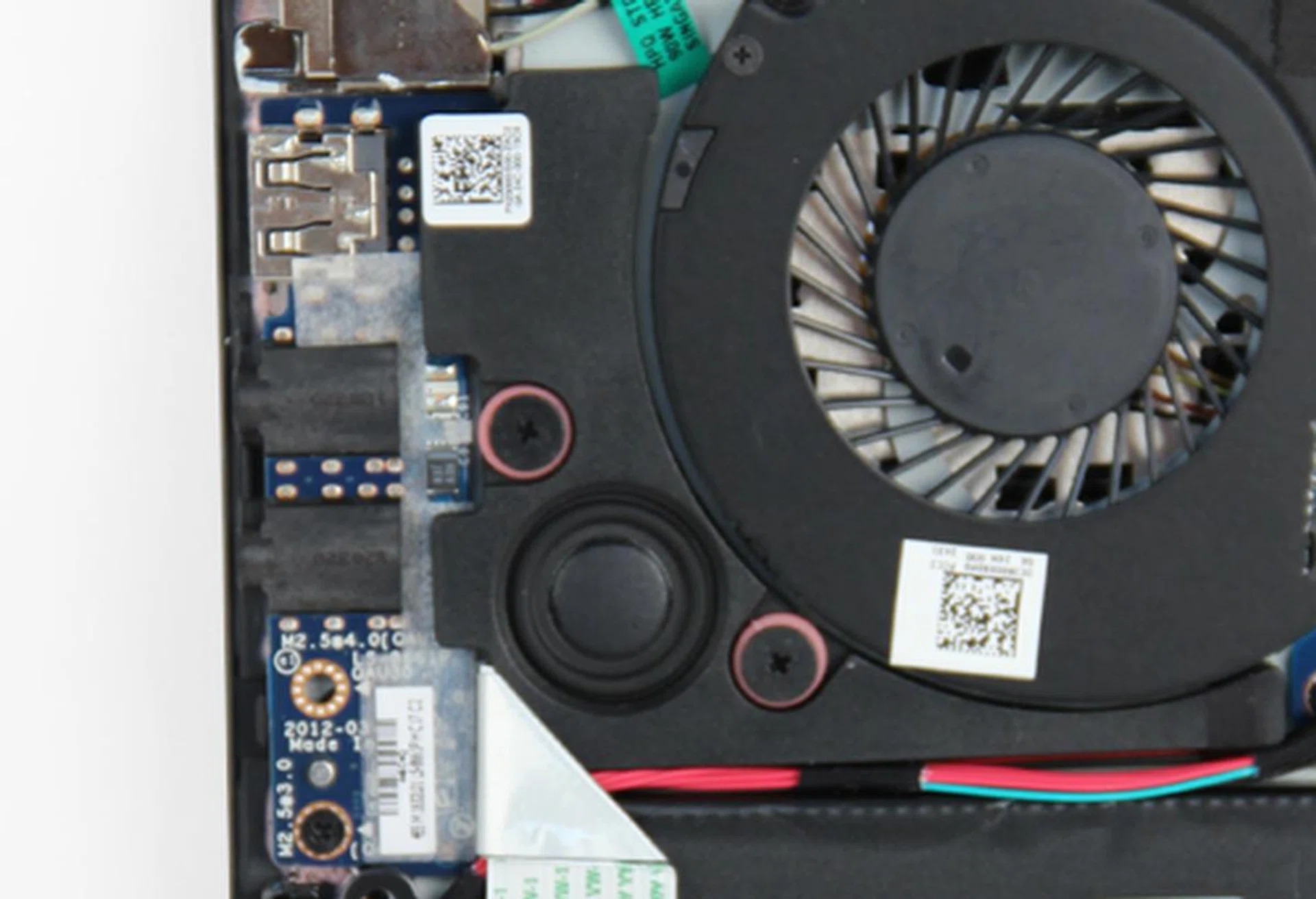 The Envy 4's subwoofer is hidden under the base plate and sandwiched between various components.