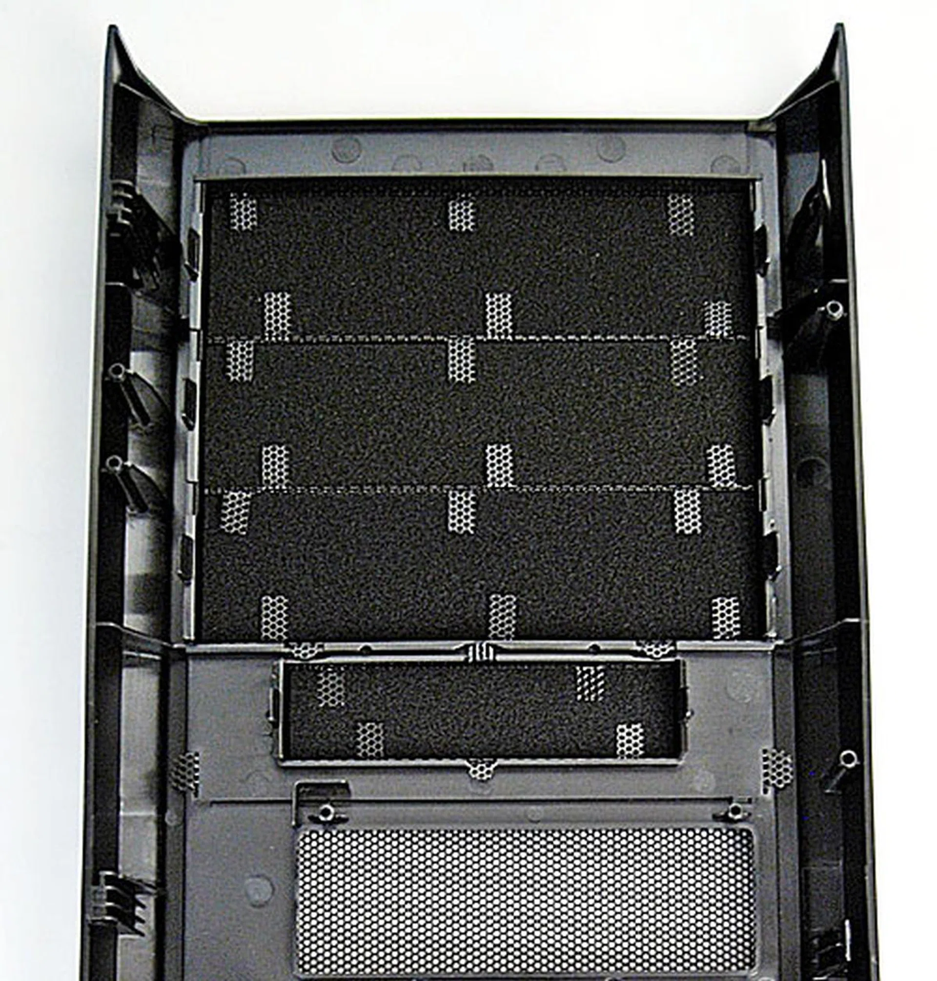 Detached front panel: Take note of the small bits of pliable wire mesh holding the washable filters in place.